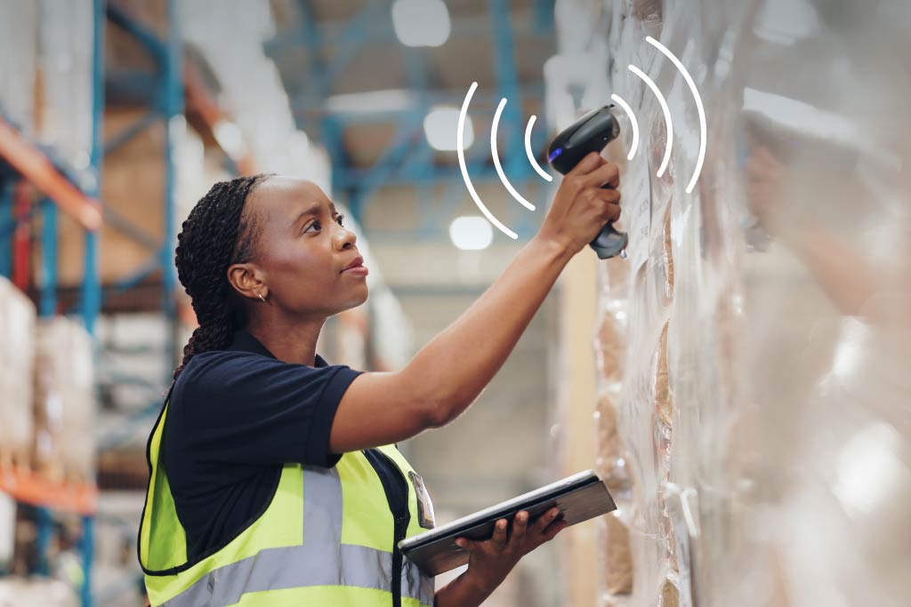 Warehouse employee using RFID scanner